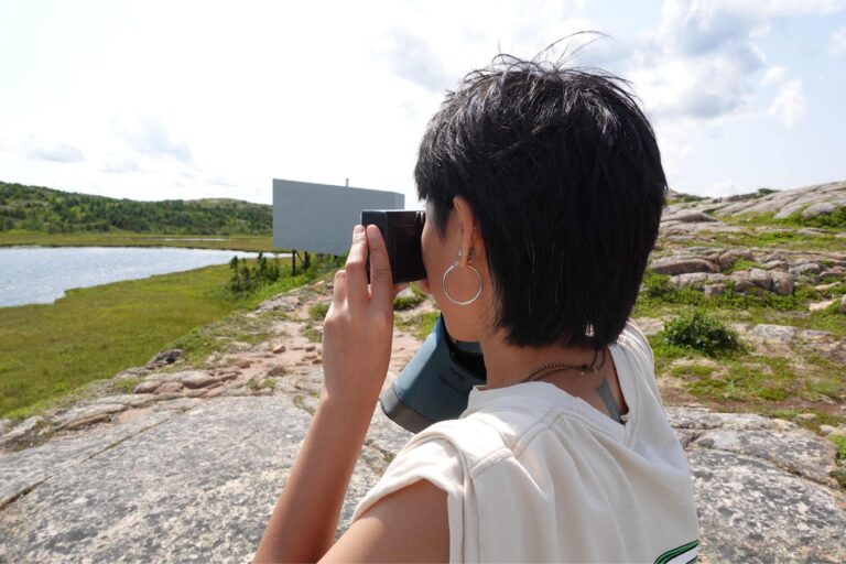 Wong Winsome Dumalagan taking photographs on Fogo Island during her residency. Courtesy of the artist Wong Winsome Dumalagan.